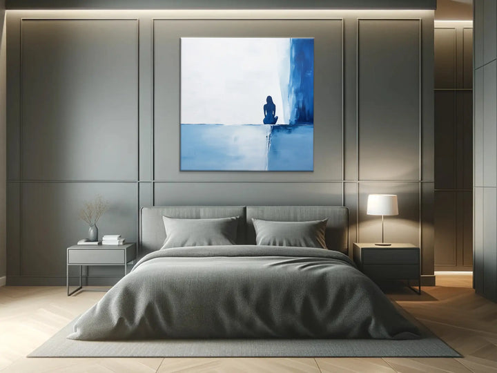 Contemplative Blue Solitary Figure Wall Art in Bedroom