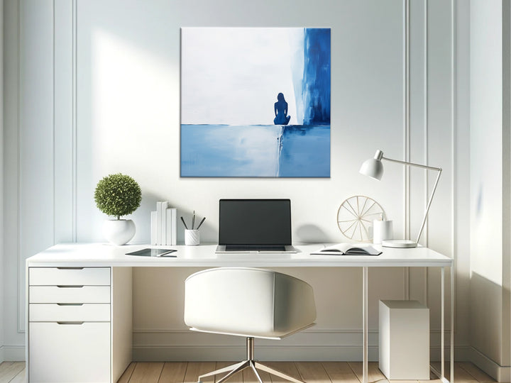 Contemplative Blue Solitary Figure Wall Art in Office