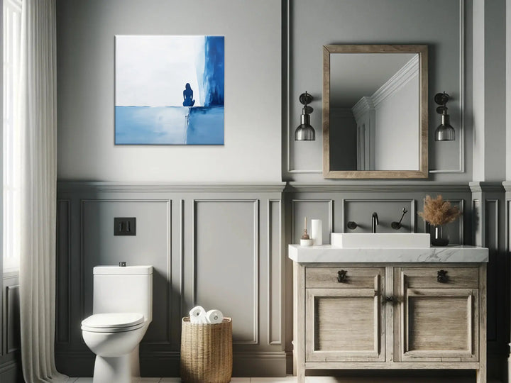 Contemplative Blue Solitary Figure Wall Art in Bathroom